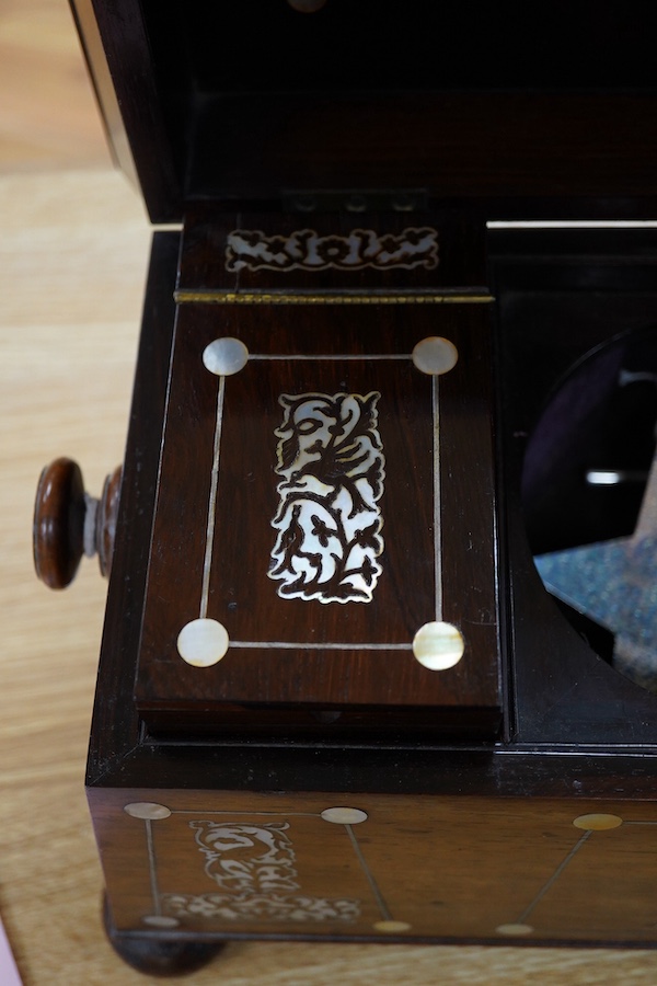 A Victorian rosewood and mother-of-pearl inlaid sarcophagus tea caddy, 39cm wide. Condition - fair